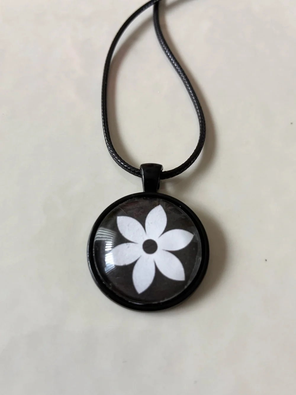Hand Crafted Black Pendant Necklace with White Flower Motif
